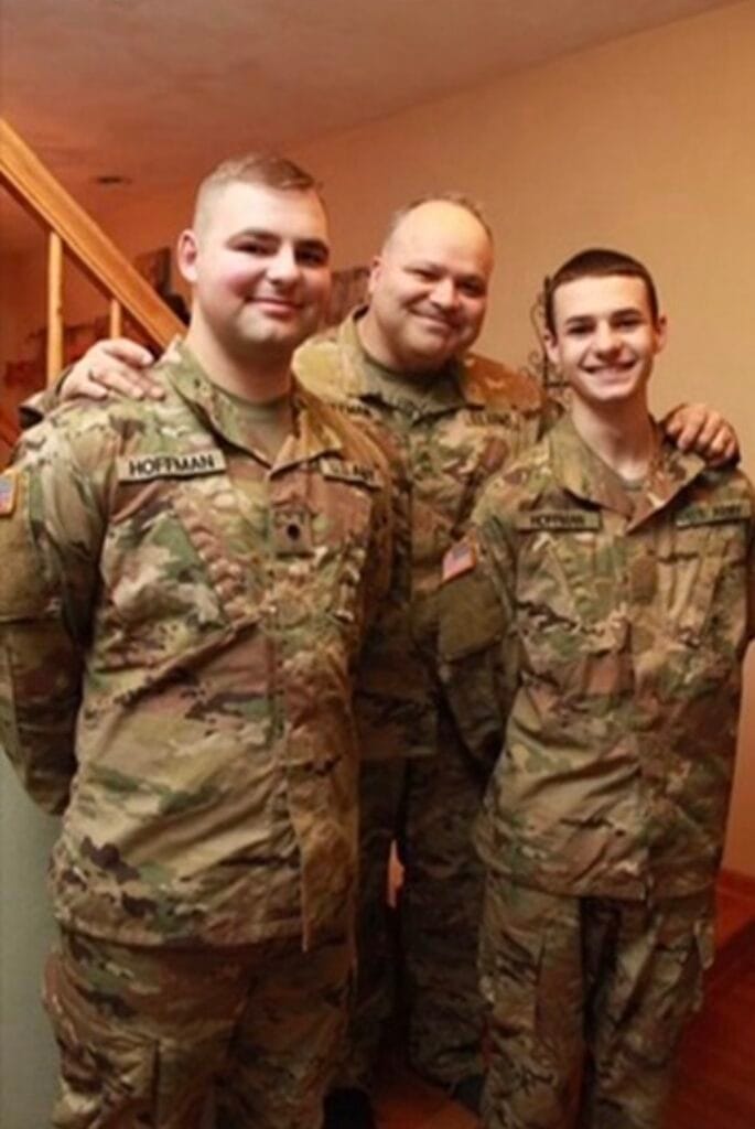 Cozy Walls owner Erik Hoffman with his two sons, all in Army uniform